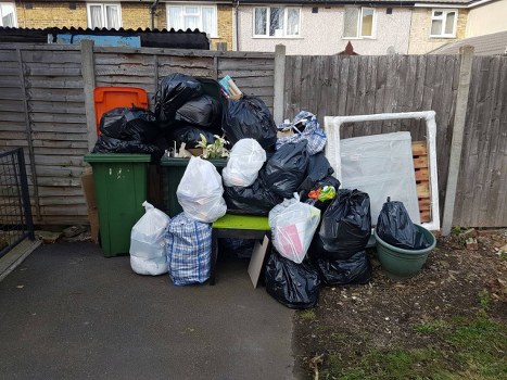 People decluttering their home during furniture clearance in Mill Hill