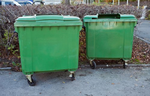 Waste collection trucks operating in Mill Hill neighborhoods
